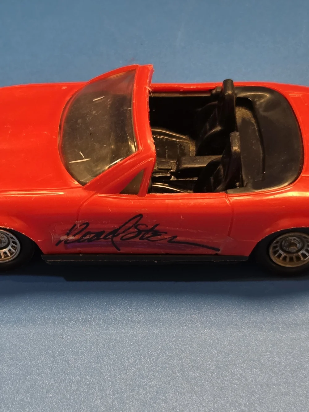 Red Convertible Toy Car with Signature-Style Side Graphic